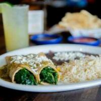 Spinach Enchiladas · Two enchiladas filled with spinach and cheese top with tomatillo sauce and fresco cheese, wh...