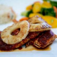 Tropical Chicken Breast · Boneless premium chicken marinated in mild guajillo red sauce. Served with white rice and st...