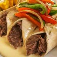 Strip Burritos · Mini burritos filled with USDA Prime NY strip steak, grilled onions and bell peppers. Topped...