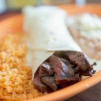 Burrito Al Carbon · Burrito smothered in cheese dip. Served with rice and refried beans.