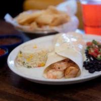 Seafood Burrito · Shrimp and tilapia in our signature guajillo sauce, topped with cheese dip. Served with rice...