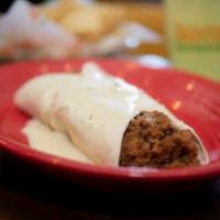 Cheesto Burrito · Your choice of shredded chicken or ground beef, covered in cheese dip.