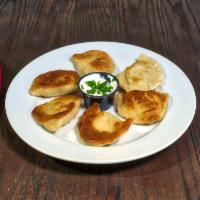 Pierogi · 6 pan-fried served with sour cream on the side.
