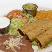 Flautas Dinner · 3 corn tortillas rolled and filled with chicken or steak lightly fried and garnished with so...