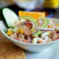 Ceviche Tropical · Tilapia and shrimp marinated and cured in freshly squeezed lime juice. Mixed with tomato, ci...