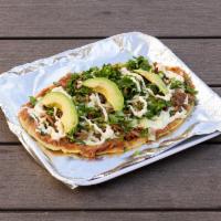 Huaraches Especiales · Handmade bean stuffed tortilla topped with your choice of sauce, cilantro, onion, and melted...