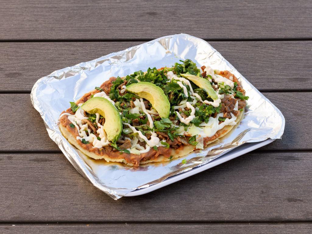 Huaraches Especiales · Handmade bean stuffed tortilla topped with your choice of sauce, cilantro, onion, and melted Mexican cheese. Your choice of meat except for Asada or Lengua