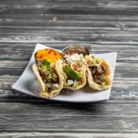 Combinacion Taco · 3 tacos soft or crispy filled with your choice of ground beef, steak, or chicken topped with...