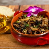 Garlic Mushrooms · A blend of mushrooms cooked in olive oil, butter, garlic, cilantro, and parsley served with ...
