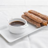 Churros with Chocolate · Served warm with chocolate sauce.