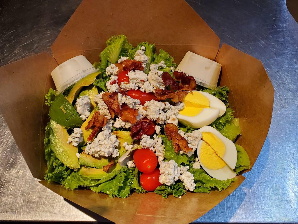 Cobb Salad · Green leaf lettuce, eggs, tomatoes, avocado and shredded cheese.