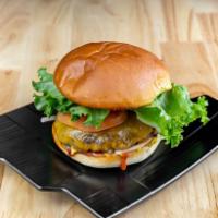The Count Burger · 6 oz. grass fed beef patty on a butter toasted potato bun with cheddar cheese, lettuce, toma...