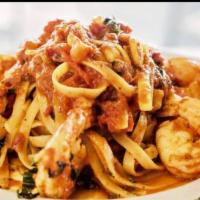 Shrimp Fra Diavolo · Sauteed shrimp in our spicy tomato sauce, served over linguine.
