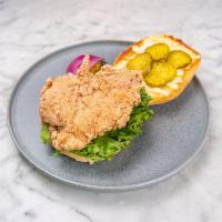 Crispy Chicken Sandwich · Our crispy chicken fried in potato starch and topped with house-made pickles, lemon and herb...
