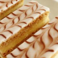 Napoleon · French pastry with 3 layers of puff pastry and 2 layers of pastry cream. Covered with fondan...