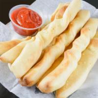 Penguino's Style Breadsticks · Topped with special garlic sauce and served with marinara dipping sauce.