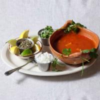 Menudo Soup · Traditional and Mexican soup (Pancita) made with beef stomach (Tripe) in a red guajilo base ...