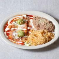 Chicken Michoacan Style Enchiladas · Corn tortillas rolled with wither sauce and cojita cheese. Garnished with lettuce tomatoes, ...