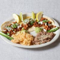 Tacos al Pastor · Served with beans, rice or fideo.