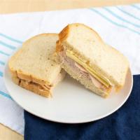 Turkey and Swiss Classic Sandwich · Honey wheat. Oven roasted tender white turkey breast with Swiss cheese and our signature sau...