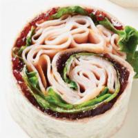 Cranberry Turkey Classic Wrap · Turkey, lettuce, Swiss cheese and jalapeno cranberry mayo on a wrap.