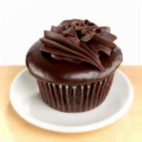 Chocolate Decadence · chocolate cake, chocolate mousse filling, chocolate ganache and dark chocolate curls.