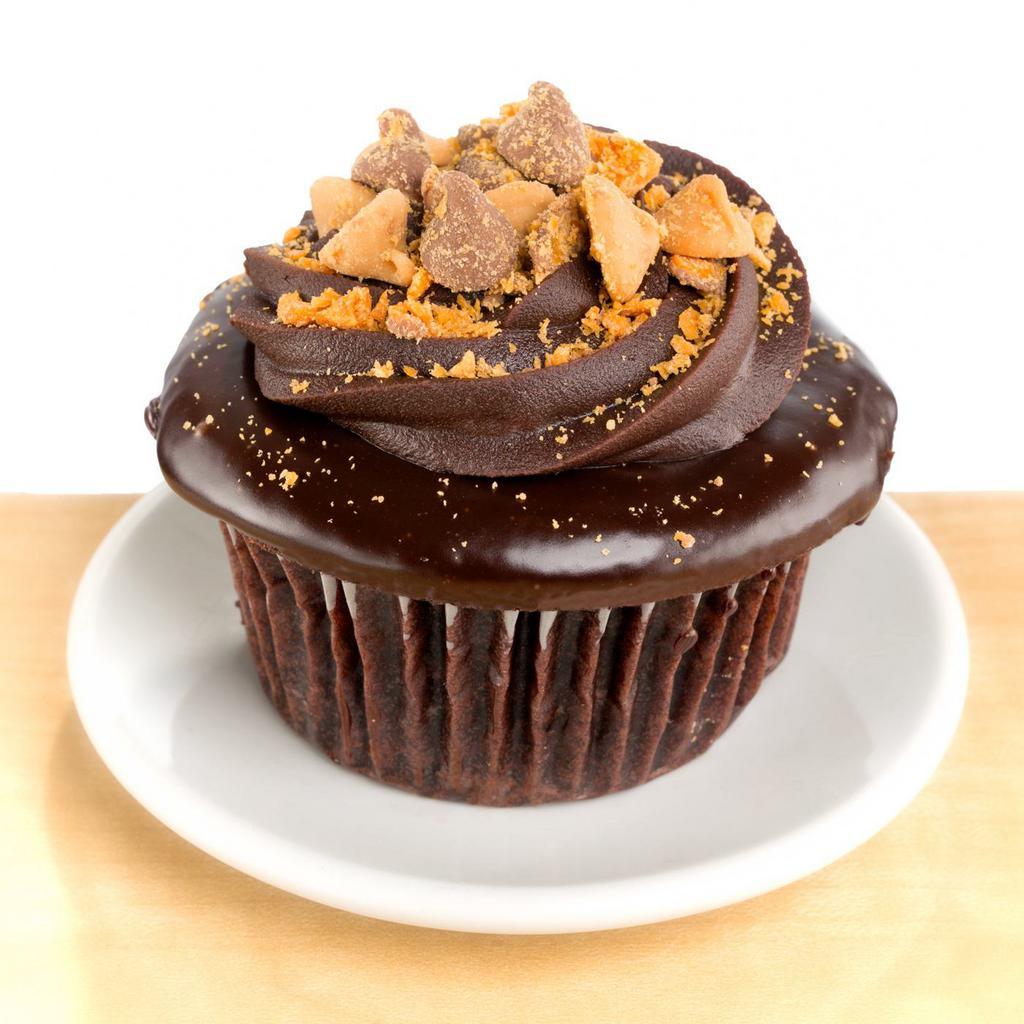The Ron Bennington · chocolate cake, peanut butter filling, chocolate ganache and crushed butterscotch topping.
