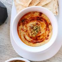 Hummus and Pita · Chickpea purée with sesame paste (tahini) and lemon juice ~ served with pita chips