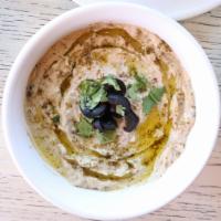 Baba Ghanouj · Grilled eggplant purée mixed with sesame paste (tahini) and lemon juice ~ served with pita c...