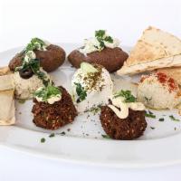 Mezze Platter · A medley of our most popular appetizers, to titillate your taste buds before enjoying your m...