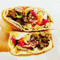 Beef Shawarma · Roasted thin slices of marinated prime beef wrapped in a pita sandwich wrap, served with tah...