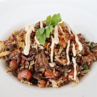 Beef Rice Bowl · Beef, Basmati Rice with Foul Moudamas, tomatoes and fresh herbs, topped with fried onions