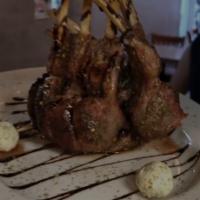 Rack of Lamb · Grilled whole rack of lamb,  caramelized onion, balsamic fig reduction sauce and crumbled fe...