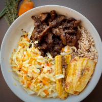 Jamaican Jerk Chick'n Bowl · Jamaica-style rice and peas (kidney beans), steam cabbage, and our flavorful jerk chick'n.