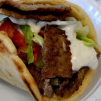 Lamb Gyro · Lamb wrapped in fluffy pita bread with lettuce, tomatoes, onion, and tzatziki sauce. Best Gy...