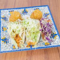 Southerd Tacos · 3 breaded and lightly fried chicken tacos, topped with pico de gallo, avocado and house tart...