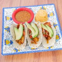 Shrimp Tacos · 3 delicious grilled shrimp tacos in your choice of tortillas filled with pico de gallo and c...