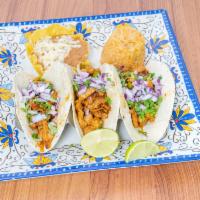 Frida's Tacos · 3 grilled chicken and chorizo tacos made with corn tortillas and topped off with queso chees...
