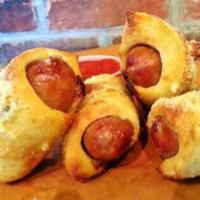 Olidunks · Italian Sausage wrapped in Sourdough and baked, drizzled in
Garlic Infused Olive Oil, sprin...