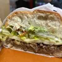 Torta de Carne Asada · A traditional Mexican sandwich made with your choice of meat, refried beans, cheese, lettuce...