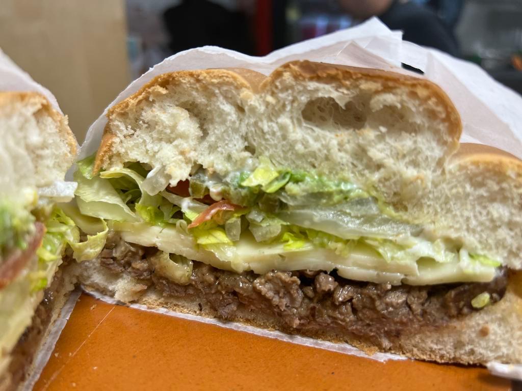 Torta de Carne Asada · A traditional Mexican sandwich made with your choice of meat, refried beans, cheese, lettuce, tomatoes, jalapeños, onions, avocado, and mayonnaise