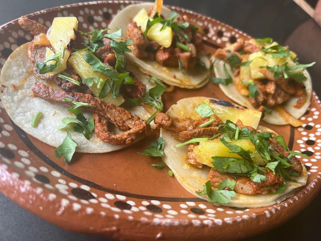 Al Pastor Taco · Pork marinated with spices and citrus then topped with pineapple.