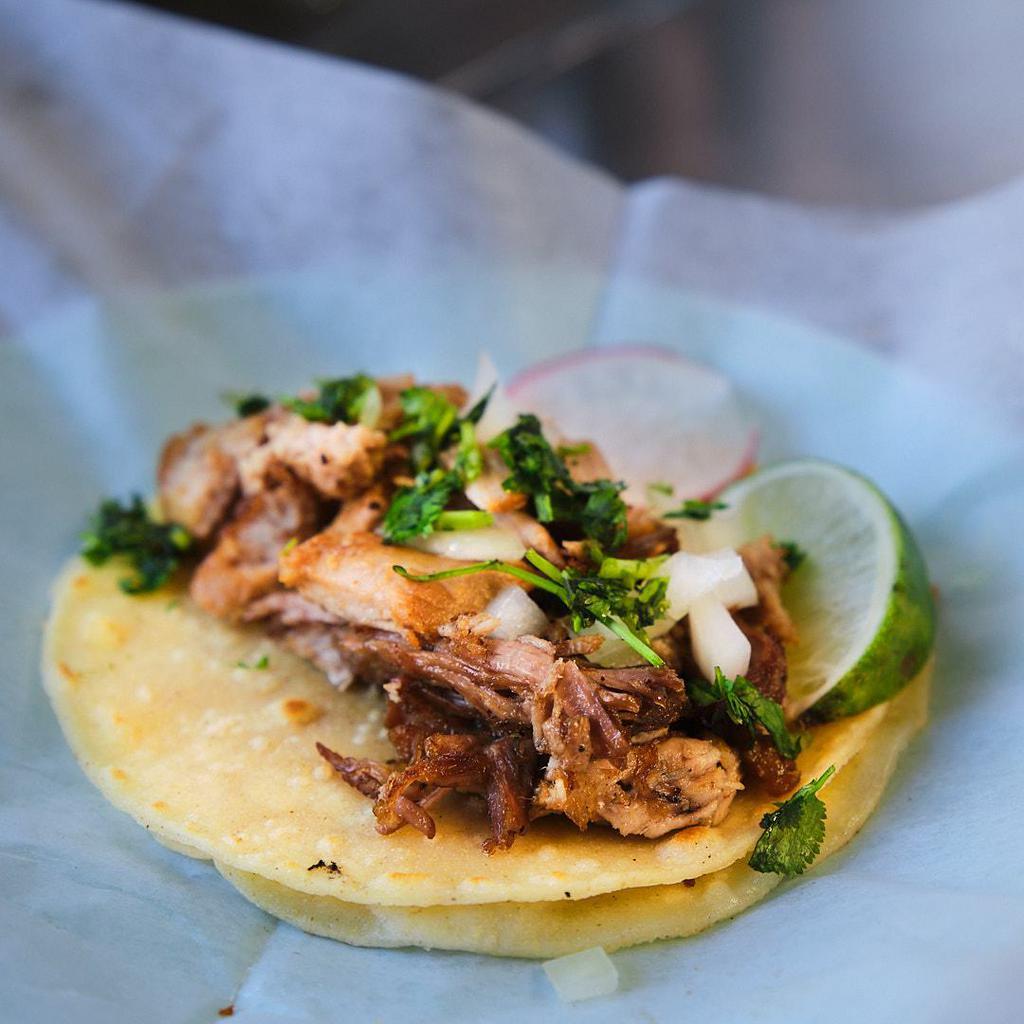 Carnitas Taco · Pork simmered in water and spices until tender, then shredded.