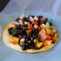 Vegetarian Taco · Zucchini, squash, peppers, onions topped with corn pico de gallo and black beans.