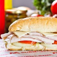 Turkey Submarine · Fresh turkey coated in mayonnaise, on top of mouth-watering veggies doused in our signature ...