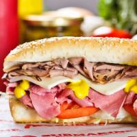Combo Submarine · Get a wonderful mix of corned beef and roast beef, on top of mouth-watering veggies doused i...