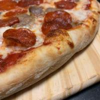 Meat Lovers Specialty Pizza · Pepperoni, sausage, ground beef, ham, Canadian bacon, and bacon.