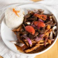 Steak and Onions Lunch · Lomo saltado tender steak stir fry sauteed with red onions, tomatoes, mushroom soy sauce, re...