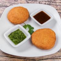 Punjabi Kachori (2 pieces) · Filled with spiced lentils. Accompanied with sweet tamarind and spicy mint sauces. 