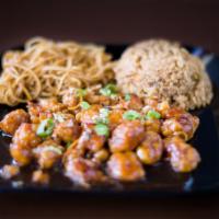 Orange Chicken · Crispy chicken with our house sweet brown sauce and orange peel.